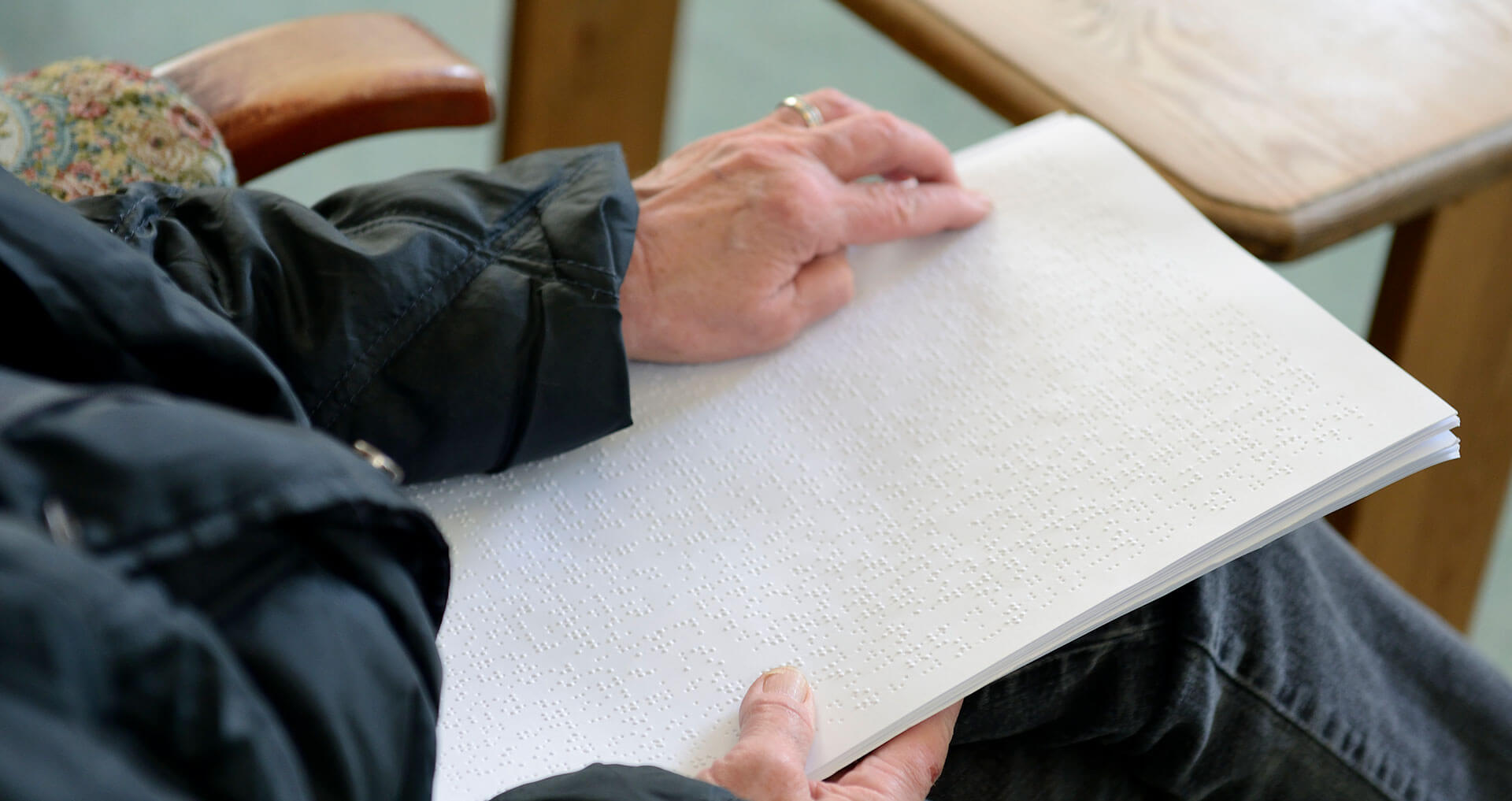 This is a picture of a client reading braille.